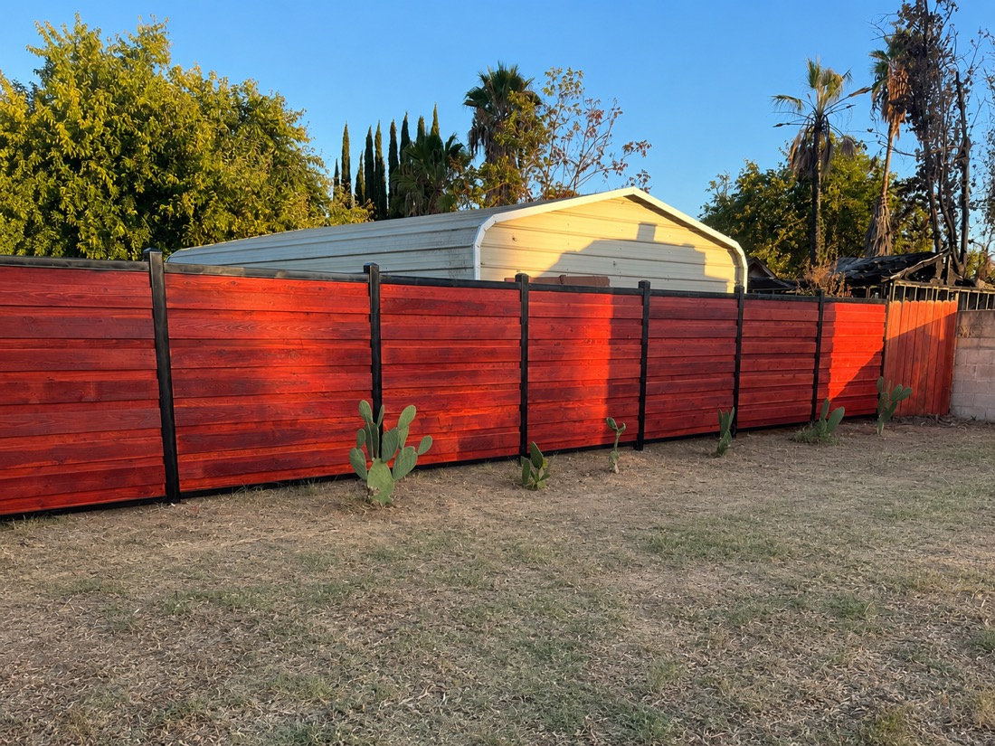 Stained wood privacy fence with steel posts — Sacramento